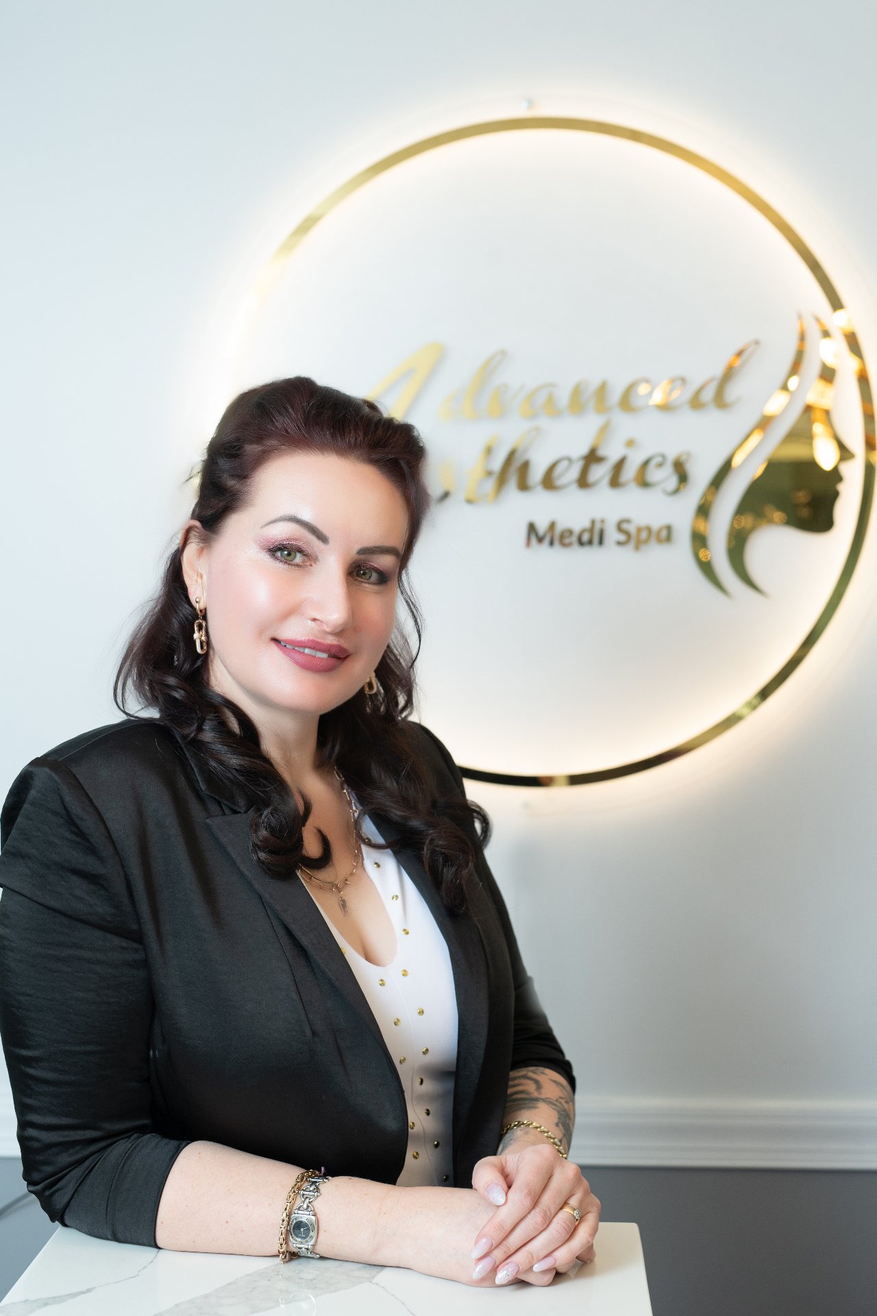 Lana Ivanov at Advanced Aesthetics Medi Spa reception desk